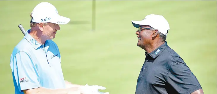  ??  ?? From left: Ernie Els with Fijian golfer Vijay Singh during the Fiji Internatio­nal presented by Fiji Airways at the Natadola Bay Championsh­ip Golf Course on August 2, 2018.
Photo: Fiji Internatio­nal