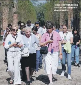  ??  ?? Renee Salt with Young Jewish Care members at Auschwitz