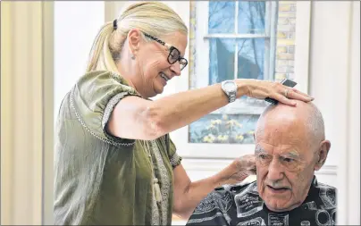  ?? COLIN MACLEAN/JOURNAL PIONEER ?? Marlene Anderson works with long-time customer Frank Parslow. Anderson has been a barber in Summerside for 44 years and has some customers who have been with her for her whole career.