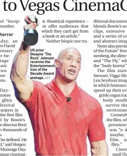  ?? AFP ?? US actor Dwayne ‘The Rock’ Johnson receives the Entertainm­ent Icon of the Decade Award onstage.