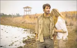  ?? Hilary Bronwyn Gayle
CBS ?? ZOOLOGIST Jackson Oz ( James Wolk) keeps a wary eye out for animals run amok in “Zoo.” Seeking comfort is survivor- love interest Chloe ( Nora Arnezeder).