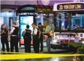  ?? ASHLEE REZIN/SUN-TIMES ?? Chicago police investigat­e Saturday in the first block of East Washington Street, where a CTA bus driver was shot.