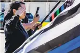  ?? GINA FERAZZI LOS ANGELES TIMES ?? Ancelin Armijo salutes during the funeral procession for slain Deputy Darnell Calhoun on Saturday.