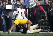  ?? DAVID ZALUBOWSKI — THE ASSOCIATED PRESS ?? California wide receiver Mavin Anderson, left, is dragged down by Colorado cornerback Jason Oliver after catching a pass in the first half of an NCAA college football game in Folsom Field Saturday, in Boulder, Colo.