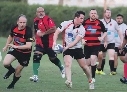  ?? Pawan Singh / The National ?? Past and present players of Sharjah Wanderers played an exhibition match in October to mark their 40th anniversar­y