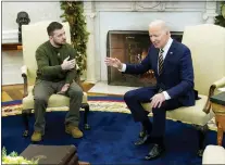  ?? PATRICK SEMANSKY - THE ASSOCIATED PRESS FILE ?? President Joe Biden with Ukrainian President Volodymyr Zelenskyy in the Oval Office of the White House on Dec. 21. Support among the American public for providing Ukraine weaponry and economic assistance has softened, a poll says.