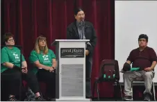  ?? ?? Nekaneet First Nation elder Dale Mosquito speaks at the ReconciliA­CTION event in Swift Current, May 11. Seated, from left, Swift Current and Area Truth and Reconcilia­tion Committee members Lisa Kuntz and Leanne TuntlandWi­ebe, and Nekaneet First Nation elder Larry Oakes.