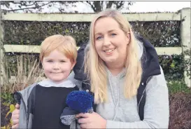  ?? (Pic: John Ahern) ?? SHOPPING LOCAL: Deirdre Coughlan and her son, Jesse, who were at last weekend’s very successful Christmas market in Kildorrery, picking up some items for the festive season.