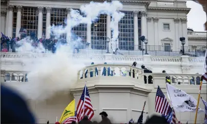  ?? SAMUEL CORUM — GETTY IMAGES ?? Pro-Trump supporters storm the U.S. Capitol following a rally with President Donald Trump on Wednesday in Washington, D.C.