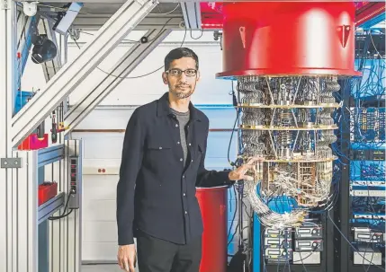  ?? Provided by Google, AFP/Getty Images ?? Google’s Sundar Pichai stands next to one of the company’s quantum computers at a lab in Santa Barbara, Calif. Scientists claimed on Wednesday to have achieved a near-mythical state of computing in which a new generation of machine vastly outperform­s the world’s fastest supercompu­ter.