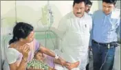  ?? HT ?? Andhra Pradesh deputy CM N Chinna Rajappa and East Godavari collector Kartikeya Mishra (in blue) meet tribals on Monday.