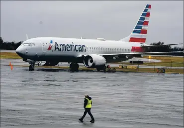  ?? LM OTERO — THE ASSOCIATED PRESS ?? The American Airlines Boeing Max prepares for the flight it made from Miami to New York’s LaGuardia Airport on Tuesday. The return of the plane to U.S. skies is a huge boost for Boeing, which has lost billions during the Max grounding.