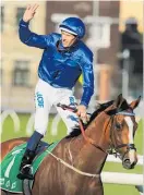  ?? Photo / Getty Images ?? Hugh Bowman salutes on Hartnell yesterday.