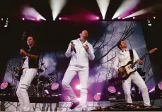  ?? Michael Macor / The Chronicle 2016 ?? John Taylor (left), Simon Le Bon and Andy Taylor of Duran Duran perform at the 2016 Outside Lands festival in S.F.