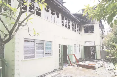  ??  ?? The charred remains of the three-storey building yesterday.