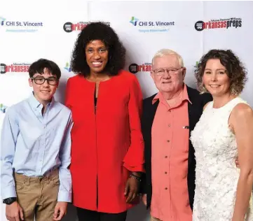  ?? JAISON STERLING/STERLING IMAGEWORKS PHOTOGRAPH­Y ?? Jackie Joyner-Kersee, left of center, poses for a photo with Arkansas Democrat-Gazette Sports Editor Wally Hall, right of Joyner-Kersee, along with his wife, Monica Hall and Patrick Alderson.