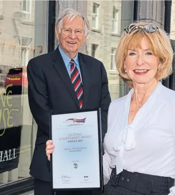  ??  ?? FIRST CLASS: Charles Skene and Helen Fitzpatric­k with her lifetime achievemen­t award.