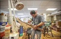  ?? RYAN C. HERMENS/LEXINGTON HERALD LEADER/TNS ?? Scott Beaty makes a guitar at the Appalachia­n School of Luthiery in Hindman, Ky. The school trains people in drug recovery to make string instrument­s.