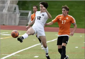  ?? PHOTOS BY BRENT W. NEW — BOCOPREPS.COM ?? Monarch’s Sam Clayton plays a ball with Legacy’s Tate Hansen behind on Thursday in Westminste­r.