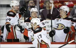  ?? JEFF MCINTOSH — THE CANADIAN PRESS VIA AP ?? The Ducks’ Alex Killorn (17) is congratula­ted after scoring one of his two goals Tuesday.