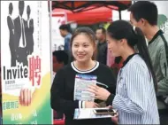  ?? LIU CHAOFU / FOR CHINA DAILY ?? Graduates participat­e in a job fair at a vocational college in the Qianxinan Bouyei and Miao autonomous prefecture in Guizhou province in June.