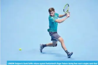  ??  ?? LONDON: Belgium’s David Goffin returns against Switzerlan­d’s Roger Federer during their men’s singles semi-final match on day seven of the ATP World Tour Finals tennis tournament at the O2 Arena in London yesterday. — AFP