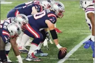  ?? Elise Amendola / Associated Press ?? Patriots center David Andrews prepares to snap the ball at the line of scrimmage against the Bills on Dec. 28.