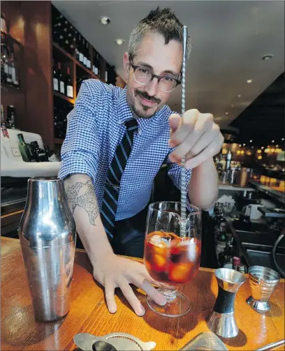  ?? PHOTOS: STEVE BOSCH/ PNG ?? Bluewater Cafe bar manager Keith Trusler shows off some basic bartender tools .