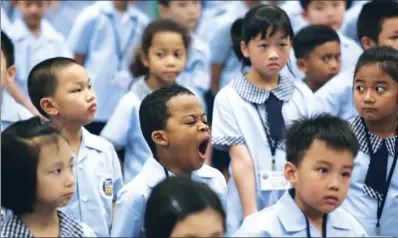  ?? / CHINA DAILY PARKER ZHENG ?? A student yawns on his first school day in the 2017-18 academic year at the Tai Kok Tsui Fresh Fish Traders’ School on Friday.