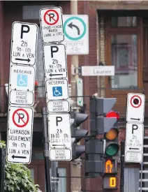  ?? DARIO AYALA/FILES ?? A confusing medley of signs greets motorists in Plateau-Mont-Royal. It’s great that the city plans to simplify parking signage, writes Josh Freed, though he worries that may mean replacing five confusing signs with a simplified one saying: “NO PARKING, PERIOD.”