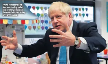 ?? AFP/GETTY IMAGES ?? Prime Minister Boris Johnson during a visit to a primary school in Beaconsfie­ld yesterday