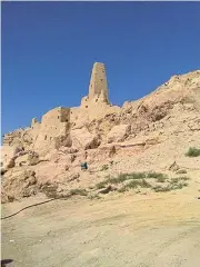  ?? /Pictures: Archie Henderson ?? Landmark: A soaring tower, all that's left of the ancient Siwa temple which Alexander the Great visited.