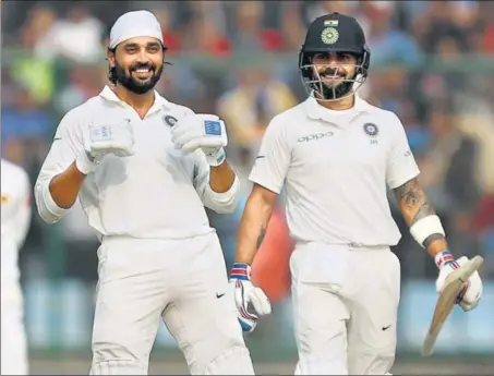  ?? BCCI ?? Murali Vijay (left) celebrates his century as India captain Virat Kohli looks on during Day 1 of the third Test against Sri Lanka at the Ferozeshah Kotla on Saturday.