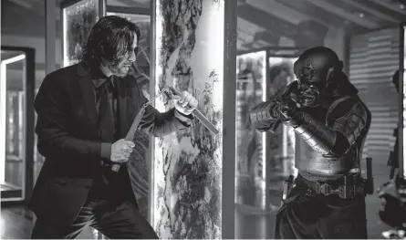  ?? Lionsgate ?? Keanu Reeves, left, returns as assassin John Wick in “John Wick: Chapter 4.”