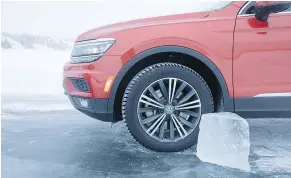  ??  ?? Forty-three cm of ice cut out of Fiddlers Lake, N.W.T., doesn’t look so thick compared with the wheel of a Volkswagen Tiguan.