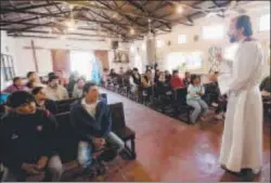  ?? Photo: GETTY IMAGES ?? HUMBLE BEGINNINGS: Mass at the Santa Maria Madre del Pueblo church in the Villa 11-01-14 slum in Buenos Aires, where Pope Francis used to perform charity work, on Sunday.