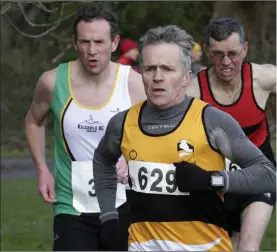  ??  ?? Liam Williams from Ashford AC chased by Kevin Kelleher and Ben Mooney.