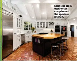  ??  ?? Stainless steel appliances complement the spacious kitchen.