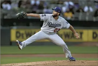  ?? Jed Jacobsohn Associated Press ?? CLAYTON KERSHAW BOUNCED BACK from a shaky opening day performanc­e in Colorado with seven strong innings against the A’s in Oakland, retiring 20 of the last 22 hitters he faced.
