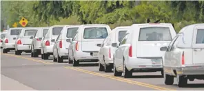  ?? MATT YORK/THE ASSOCAITED PRESS ?? Hearses carry 10 family members Tuesday from St. Patrick Catholic Church in Scottsdale, Ariz., to the graveyard. They were killed in a flash flood earlier this month while they celebrated a birthday.