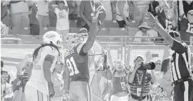  ?? JOE CAVARETTA/STAFF FILE PHOTO ?? Philip Wheeler watches as Green Bay’s Andrew Quarless celebrates a game-winning TD last season. “Last year, counting the Detroit game and when we had Green Bay, those two games came down to the last play of the game. If we win those games we’re in the...