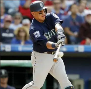  ?? MATT SLOCUM — THE ASSOCIATED PRESS ?? Seattle’s Carlos Ruiz hits a three-run double off Phillies relief pitcher Joaquin Benoit during the seventh inning Wednesday at Citizens Bank Park. Seattle won, 11-6.