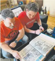  ?? Patrick Saunders, The Denver Post ?? J.B. Bissell and his son, Dade, look at newspaper clippings of dad’s glory days at Longmont High.