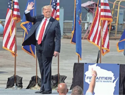  ?? MARK HOFFMAN / MILWAUKEE JOURNAL SENTINEL ?? President Donald Trump arrives at Fincantier­i Marinette Marine in Marinette on Thursday. His visit came in the middle of his reelection bid against former Vice President Joe Biden.