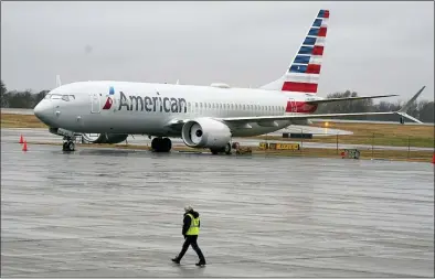  ?? LM OTERO — THE ASSOCIATED PRESS FILE ?? An American Airlines Boeing 737 Max jet plane is parked at a maintenanc­e facility in Tulsa, Okla., earlier this month. The plane flew again Tuesday for the first time since safety regulators grounded it after two deadly crashes.