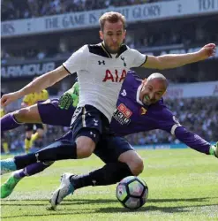  ??  ?? LONDON: Tottenham Hotspur’s English striker Harry Kane shoots past Watford’s Brazilian goalkeeper Heurelho Gomes but fails to score during the English Premier League football match between Tottenham Hotspur and Watford at White Hart Lane in London,...