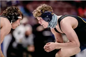  ?? NATE HECKENBERG­ER - FOR MEDIANEWS GROUP ?? Pope John Paul II’s Alan Alexander squares off against Devon Deem in a 7-0loss in the 152-pound consolatio­n semifinal.