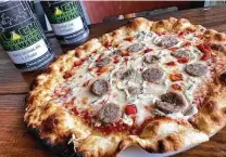  ?? Mike Sutter / Staff file photo ?? For pies such as this one with Italian sausage, ricotta cheese and roasted red bell pepper, we rate Truth Pizzeria as No. 7 in our list of best pizzerias in the city.