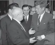  ?? THE ASSOCIATED PRESS ?? In this file photo, Soviet Premier Khrushchev gestures with both hands as he greets President John Kennedy on Kennedy’s arrival at Soviet Embassy in Vienna. At center is Soviet Foreign Minister Andrei Gromyko. Although the moment, protagonis­ts and...