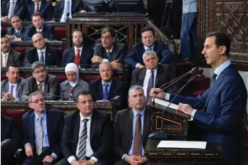  ??  ?? A handout picture made available on the Syrian Presidency Facebook page shows Syrian President Bashar alAssad addressing the new Parliament in Damascus on Monday. — AFP